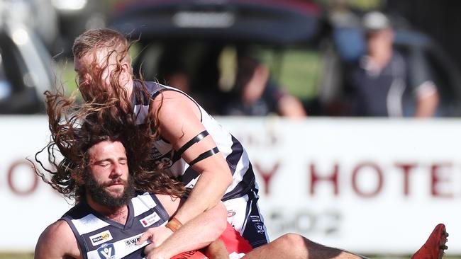 Strathfieldsaye’s Jye Formosa is tackled to the ground.