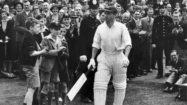 Spectators clapping Sir Don Bradman during the Fourth Test match at Headingley, Leeds, in 1938. Picture: Fox Photos/Getty Images