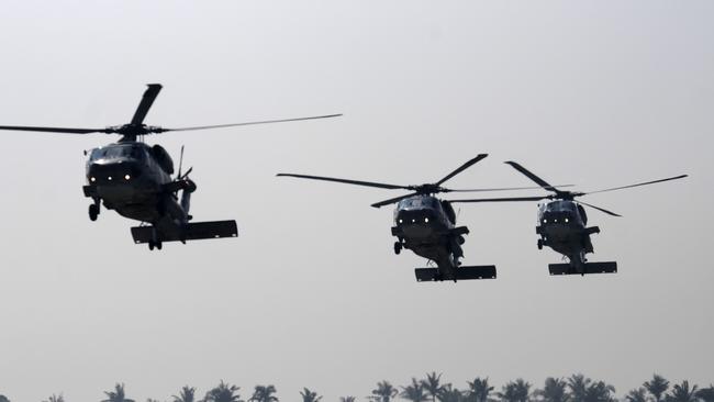 Three anti-submarine S-70C helicopters fly in formation during an annual drill at the Tsoying navy base in Kaohsiung, southern Taiwan. Picture: AFP