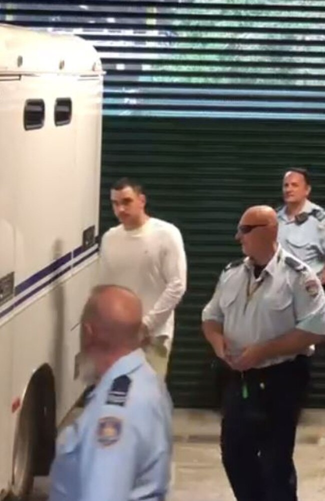 Matthew Flame is led from court after he was charged with the alleged murder of Liam Anderson, son of Rose Tattoo frontman Angry Anderson. Picture: Olivia Caisley/The Australian