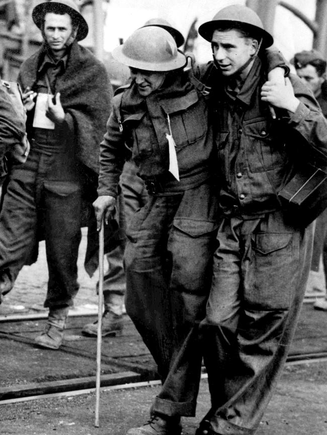 A wounded man is helped ashore at Dover after being ecavuated from Dunkirk.