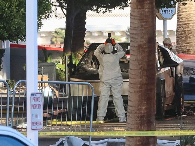 An investigator photographs a Tesla Cybertruck that exploded outside the lobby of President-elect Donald Trump’s hotel in Las Vegas. Picture: AFP