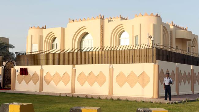 Security guards stand outside the new Taliban political office in Doha. (Photo AFP)