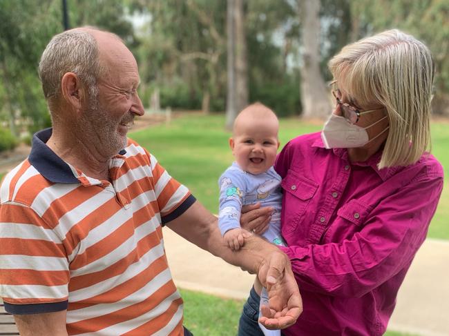 Stuart and Julie Pitson with their granddaughter Hallie, who at one point they thought Stuart would never get to meet. Photo: Supplied