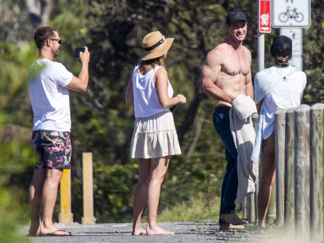 Chris appeared happy to meet with some locals. You’d be laughing too. Chris appeared happy and relaxed before his surf session. Picture: Media-Mode