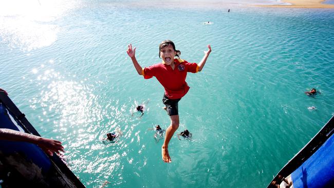 Palm Island kids jumping off the jetty. Pic Mark Calleja