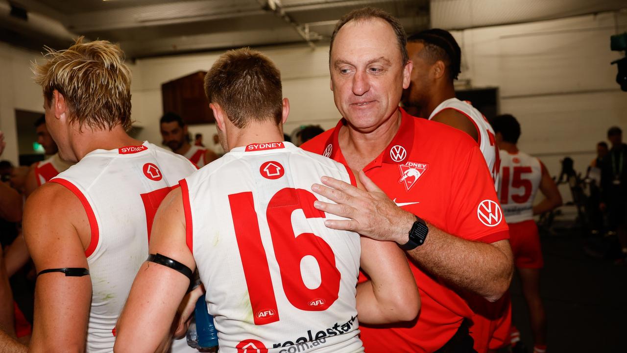 MELBOURNE, AUSTRALIA - MARCH 15: John Longmire, Senior Coach of the Swans celebrates with Braeden Campbell of the Swans during the 2024 AFL Round 01 match between the Collingwood Magpies and the Sydney Swans at the Melbourne Cricket Ground on March 15, 2024 in Melbourne, Australia. (Photo by Dylan Burns/AFL Photos via Getty Images)