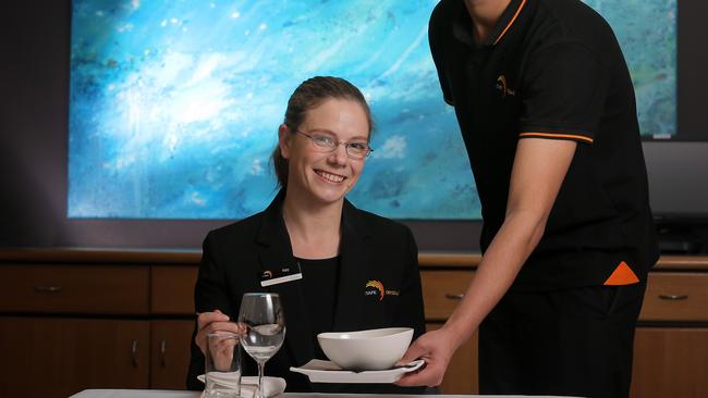 Certificate 3 in Hospitality student Kamal Parmar serves Restaurant Manager Kate Delaney. TasTAFE Drysdale and Tasmanian Hospitality Association agreement to work on better standards and numbers of graduates