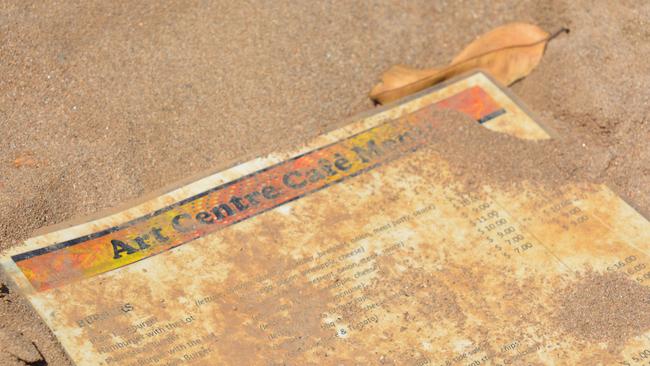 A tattered menu from the heavily damaged cafe at Wujal Wujal. Picture: Bronwyn Farr