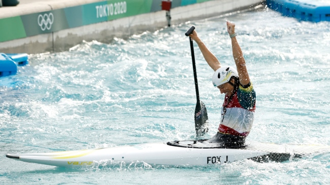 Jess Fox celebrated after seeing her name atop the leaderboard of the women's C-1 canoe slalom final. Photo: Adam Pretty/Getty Images