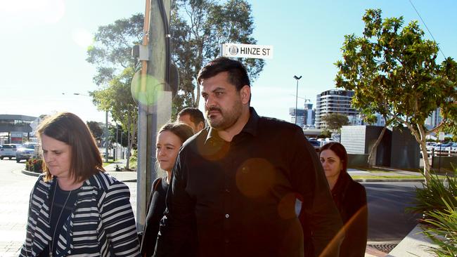 Dreamworld engineer Mark Gordon (centre) arrives for the inquest into the Dreamworld disaster at the Magistrates Court at Southport on the Gold Coast, Friday, June 29, 2018. (AAPImage/David Clark)