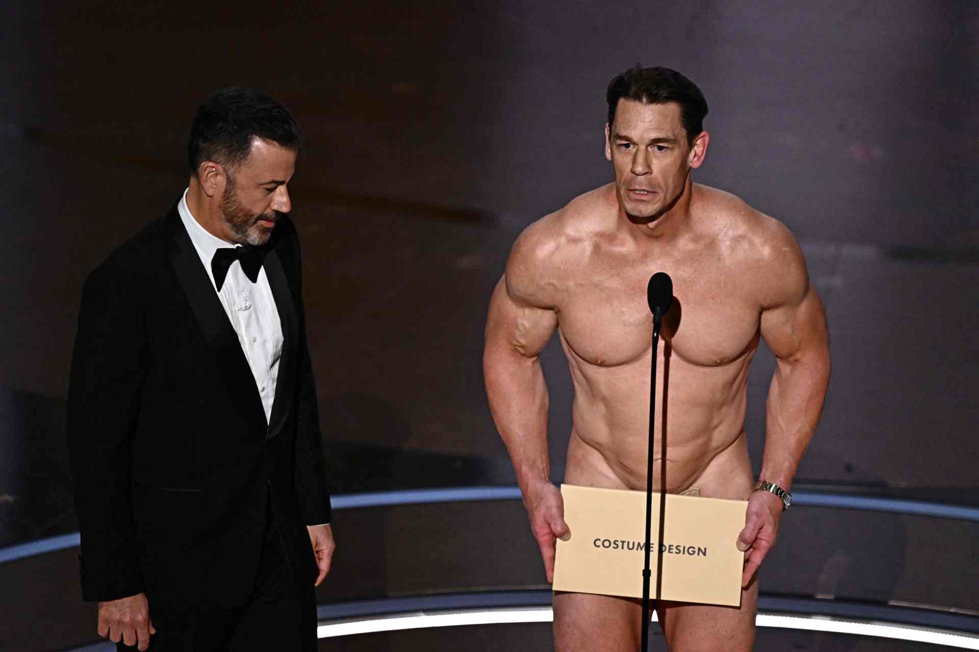 <p><em>Image credit: AFP</em></p><h3>50 years later, Jimmy Kimmel reminded everyone of the Oscar streaker</h3><p>Back in 1974, photographer Robert Opel streaked across the Oscars stage, offering a peace sign with his hands while Richard Niven was introducing Elizabeth Taylor to the stage. 50 years on, in a nod to the streak, host Jimmy Kimmel helped introduce one of the more buff streakers in history&mdash;wrestler John Cena&mdash;to help present the award for Costume Design.</p>