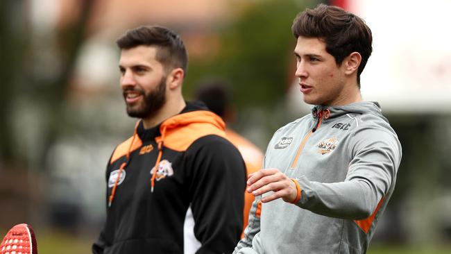 Mitchell Moses and James Tedesco during West Tigers training.