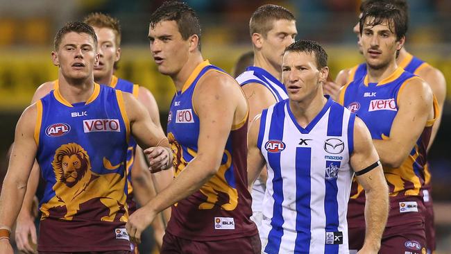 Brent Harvey remonstrates with Tom Rockliff after the game.