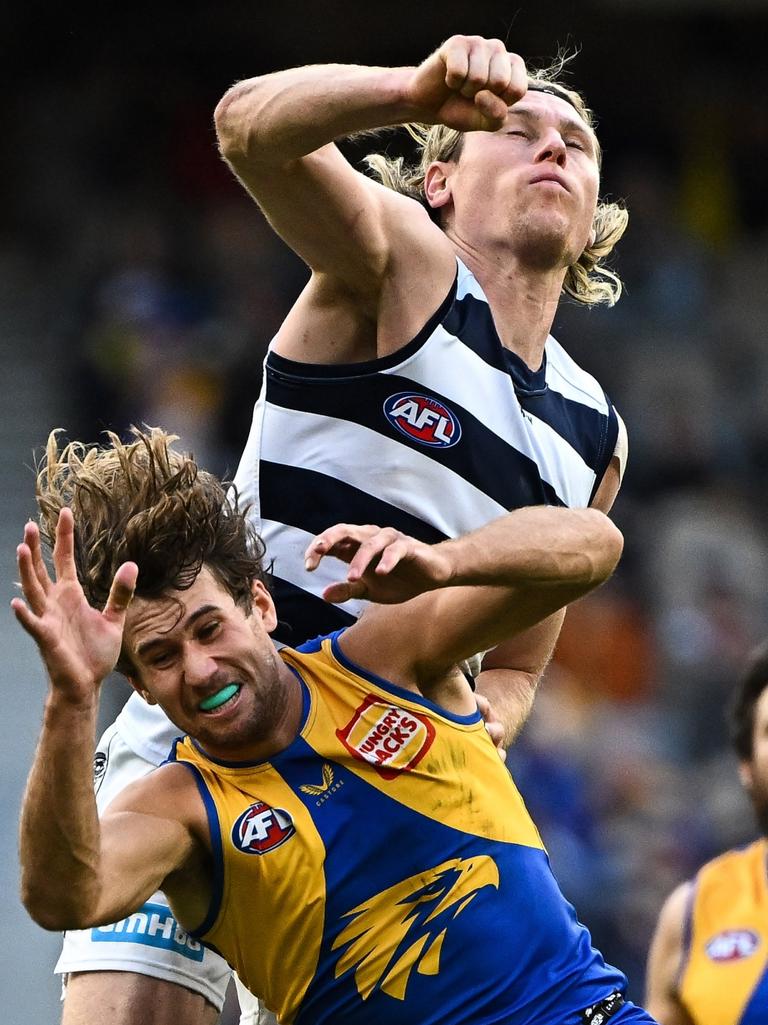Mark Blicavs punches away from Connor West. Picture: Daniel Carson/AFL Photos via Getty Images