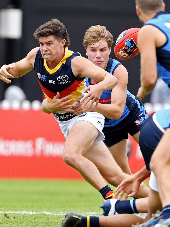  Sturt's Sam Colquhoun tackles Adelaide's Ned McHenry.  Picture: Tom Huntley