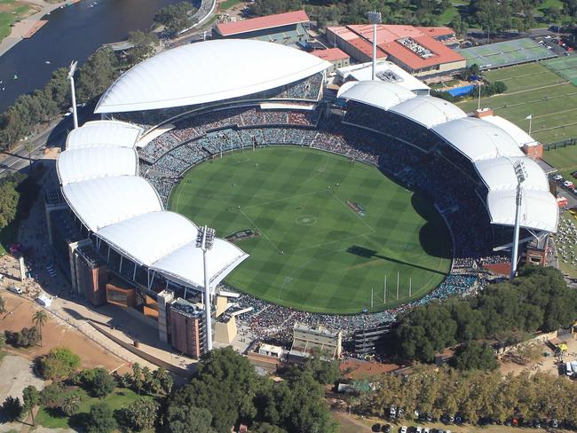 29/03/14 - Aerial photos from the 7 News helicopter of the first AFL game at Adelaide Oval, between the Crows and the Power. Pic. Dean Martin