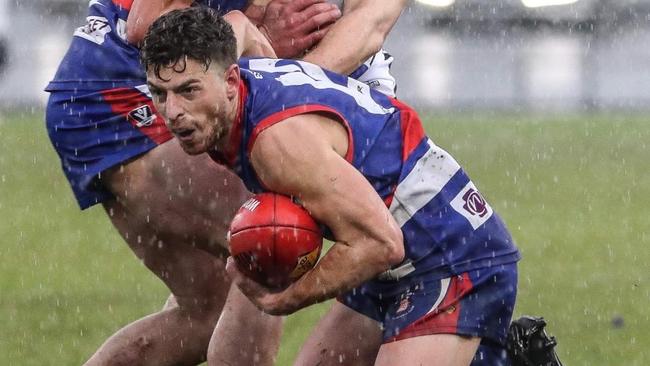 Gisborne's 	Liam Rodgers tries to get rid of the ball in the grand final. Picture: SAA Imaging.