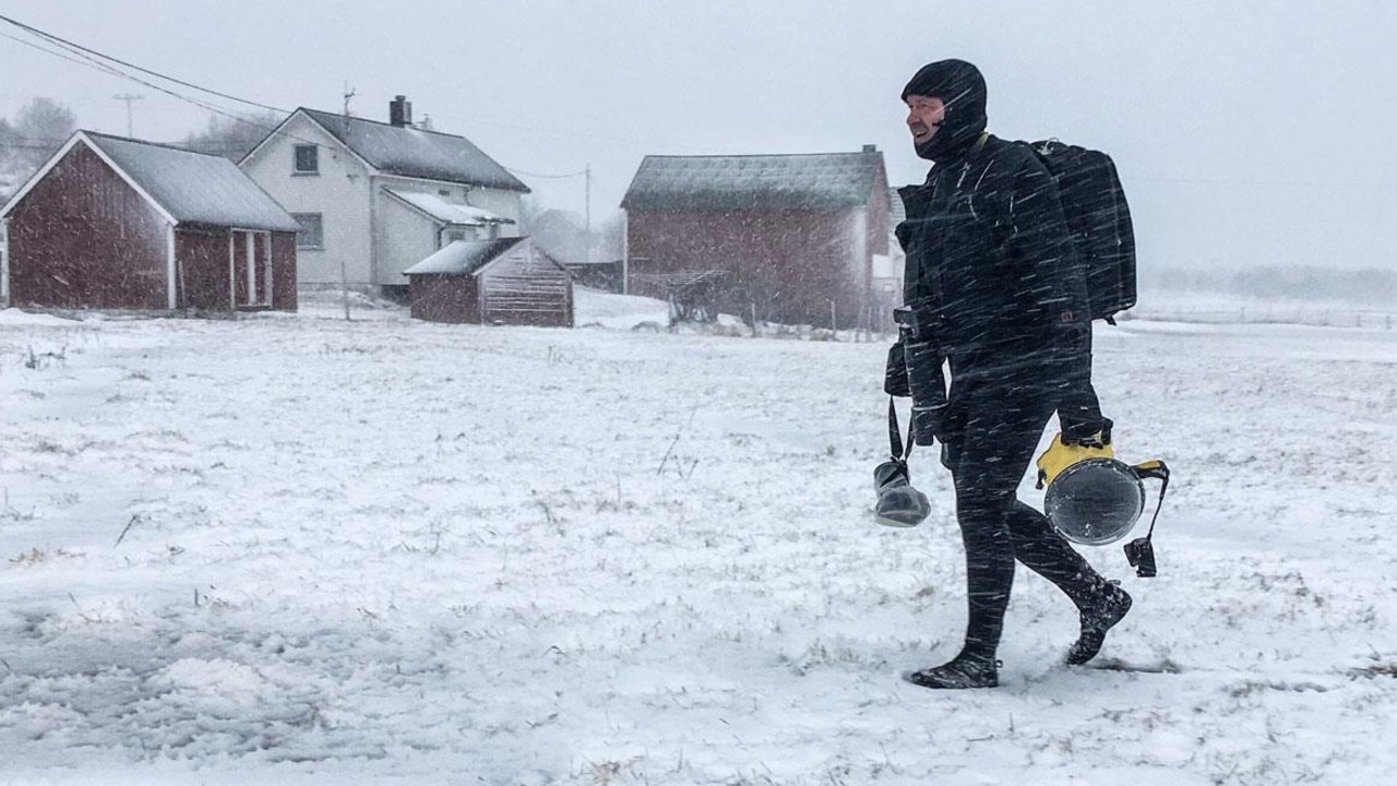 Photographer Olivier Morin walks out of the water after documenting the surfers’ experiments. Picture: courtesy of Olivier Morin