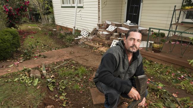 CLOSE CALL: Nigel Hill was lucky to escape uninjured after a car crashed through his South Toowoomba front yard, metres from where he and his partner were sleeping. Picture: Kevin Farmer