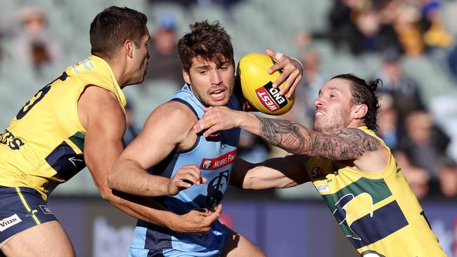 James Battersby under pressure from Jared Petrenko and James Boyd. Picture Sarah Reed