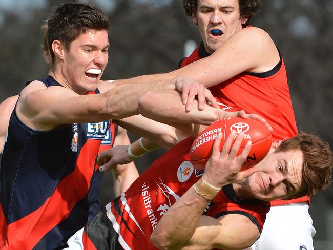 John Tynan taking a strong mark for Frankston. Picture: Adam Elwood