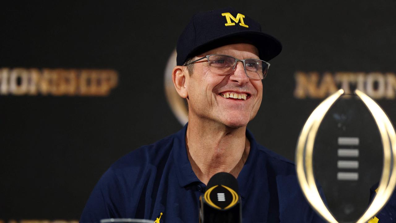 HOUSTON, TEXAS - JANUARY 08: Head coach Jim Harbaugh of the Michigan Wolverines reacts during the press conference after defeating the Washington Huskies during the 2024 CFP National Championship game at NRG Stadium on January 08, 2024 in Houston, Texas. Michigan defeated Washington 34-13. Maddie Meyer/Getty Images/AFP (Photo by Maddie Meyer / GETTY IMAGES NORTH AMERICA / Getty Images via AFP)