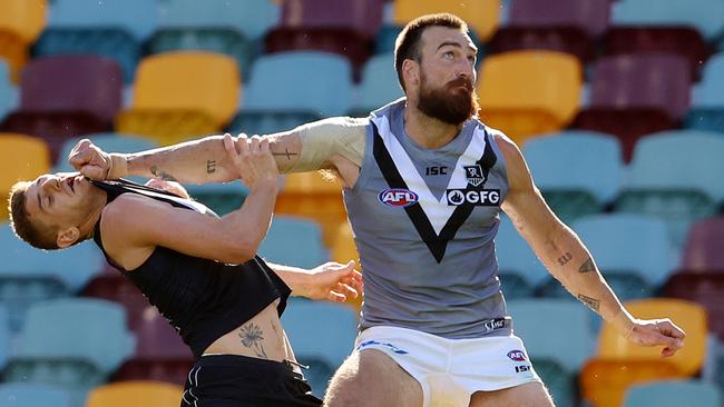 Charlie Dixon holds Carlton defender Liam Jones out of a contest. Picture: Michael Klein