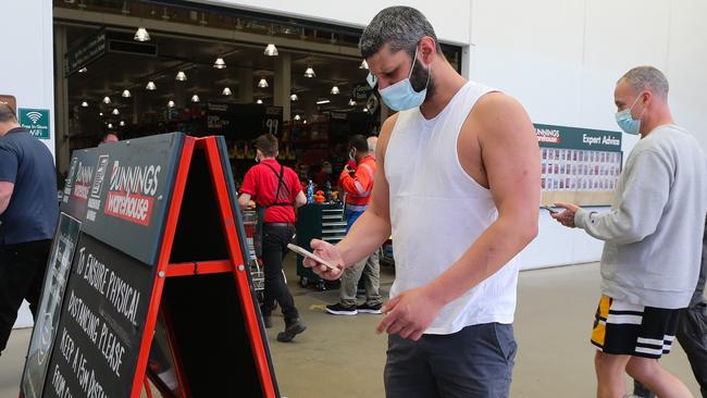 People doing a Covid-19 check-in in the Sydney suburb of Alexandria. Picture: NCA NewsWire / Gaye Gerard