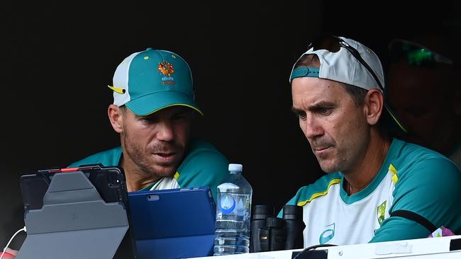 David Warner and the national coach during day two of the Adelaide Test. Picture: Getty Images