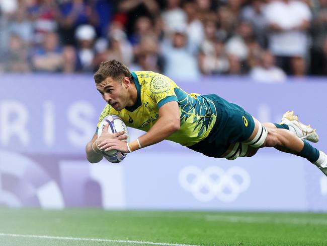 PARIS, FRANCE - JULY 27: Nathan Lawson of Team Australia scores a try in the Men’s Rugby Sevens Bronze Medal match between Team South Africa and Australia on day one of the Olympic Games Paris 2024 at Stade de France on July 27, 2024 in Paris, France. (Photo by Hannah Peters/Getty Images)