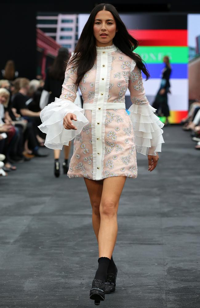 Jessica in a frilled trumpet-sleeve mini-dress. Picture: Jonathan Ng