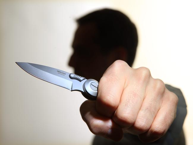 Generic image of a knife-wielding lunatic. Stabbing. Stabbed. Crime. Knife crime. Knives. Man.