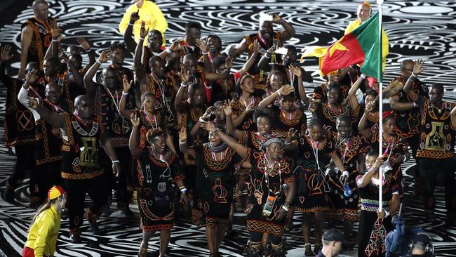 The Cameroon team marches into Carrara Stadium for the opening ceremony for the 2018 Commonwealth Games. By the time the Games ended, one-third of the team’s athletes were missing from the athletes’ village. Picture: AP/Mark Schiefelbein