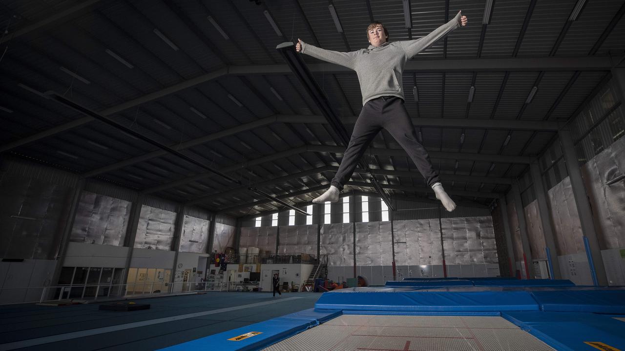 Don’t look down: James practises his signature move at the Eastside Activity Centre at Rokeby in Tasmania. Picture: Chris Kidd