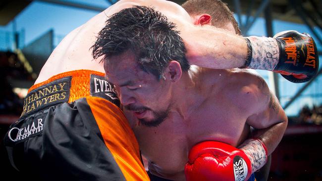 Manny Pacquiao and Jeff Horn wrestle during the bout. Picture: AFP