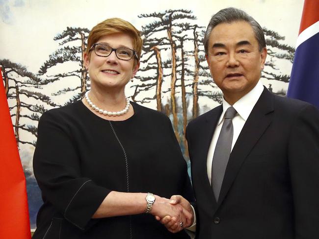 Australian Foreign Minister Marise Payne, left, and Chinese Foreign Minister Wang Yi shake hands at the end of a joint press conference at the Diaoyutai State Guesthouse in Beijing, Thursday, Nov. 8, 2018. The foreign ministers of China and Australia are meeting in what is being seen as a sign of a thaw in the recently frosty relationship between the key economic partners. (AP Photo/Mark Schiefelbein)