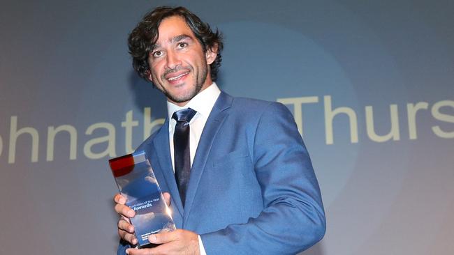 Queensland Australian of the Year winner Johnathan Thurston poses with his award.