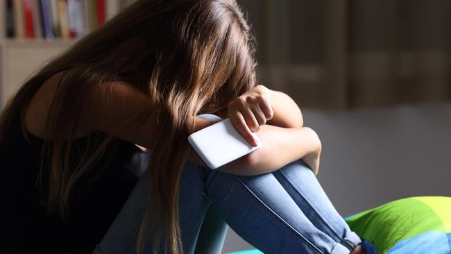 A former schoolgirl has launched legal action claiming her school failed to protect her from bullies.