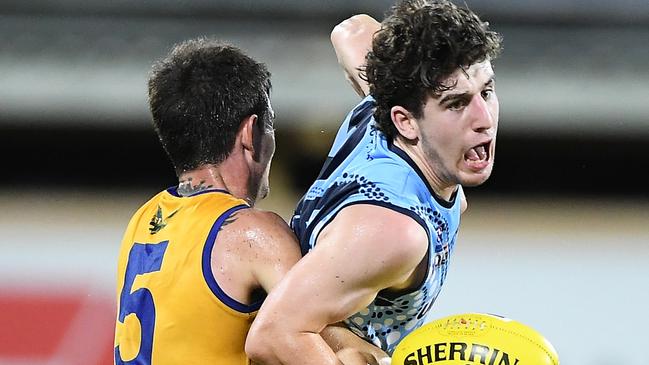 Wanderers' Simon Bates grabs Buffalo Max Kennedy in an example of the Eagles' defensive pressure during their 50-point win. Picture: Felicity Elliott AFLNT/Media