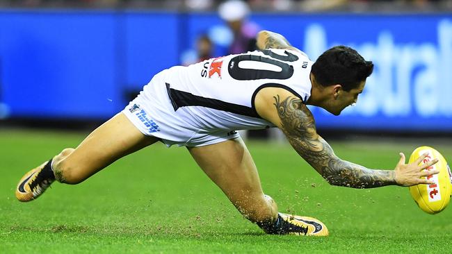 Chad Wingard at full stretch for Port Adelaide against Essendon. Picture: Mark Brake/Getty Images