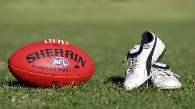 Generic AFL Sherrin football and football boots. sport /