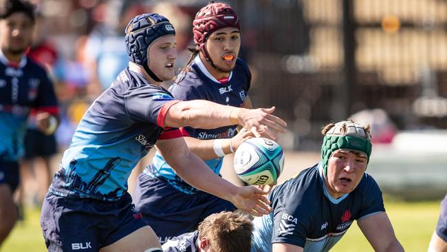 Oliver McCrea gets a pass away in the Gen Blue v Rebels match. Pic: Julian Andrews.