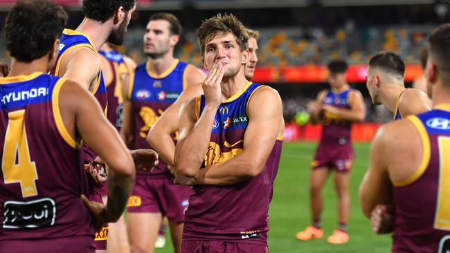 BRISBANE, AUSTRALIA - MARCH 28: Brisbane Lions react after their defeat during the round three AFL match between Brisbane Lions and Collingwood Magpies at The Gabba, on March 28, 2024, in Brisbane, Australia. (Photo by Albert Perez/AFL Photos via Getty Images )