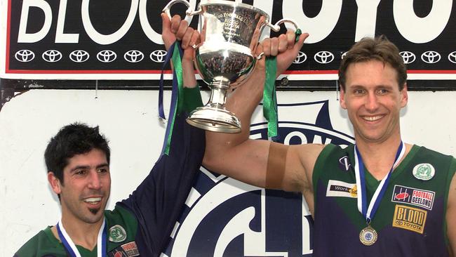 saints coach Frank Fopiani and Tom Gilligan get their hands on the GFL premiership cup.GFL Grand Final 2004North Shore vs St Mary's