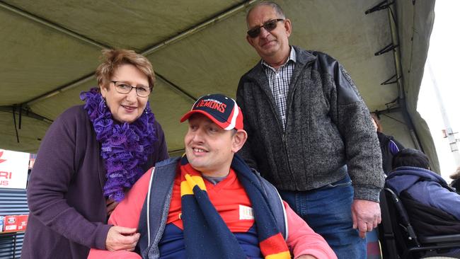 Daniel Harris with parents Denise and David Harris at Berri Memorial Oval. Picture: BERNARD HUMPHREYS