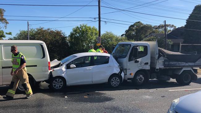 A hatchback was crushed between a van and a tipper truck in the four-car crash that disrupted morning peak hour traffic. Picture: Jim O'Rourke