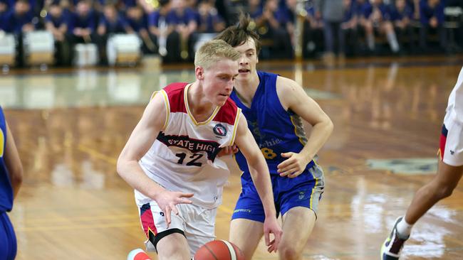 Action from the GPS basketball round 1 match between Brisbane State High and Churchie. Pictured is BrisbaneÃ&#149;s Kailan Sales and ChurchieÃ&#149;s Nash Harding. Picture: Tertius Pickard