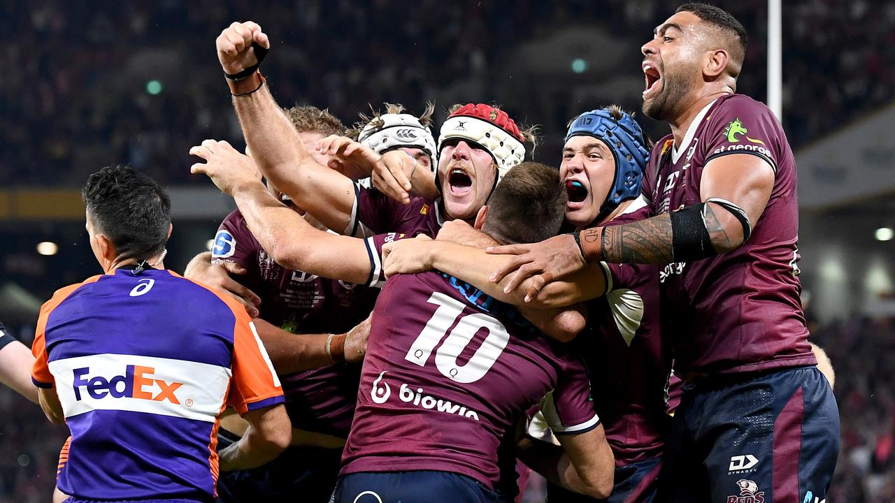 James O'Connor is swamped by teammates after scoring the matchwinning try against the Brumbies. Photo: Getty Images