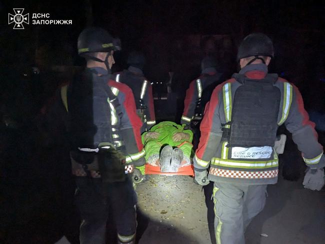 Rescuers carry a wounded person at the site of a Russian night strike in Zaporizhzhia, amid the Russian invasion of Ukraine. Picture: AFP